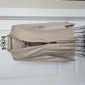 Venus, tan sweater with gold buckle. Size small.